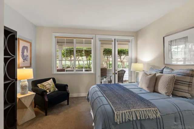 a large bathroom with a large mirror vanity and shower
