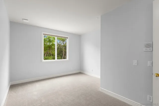 a view of a patio with table and chairs and couches