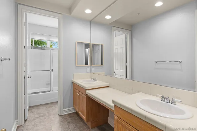 a view of swimming pool with table and chairs