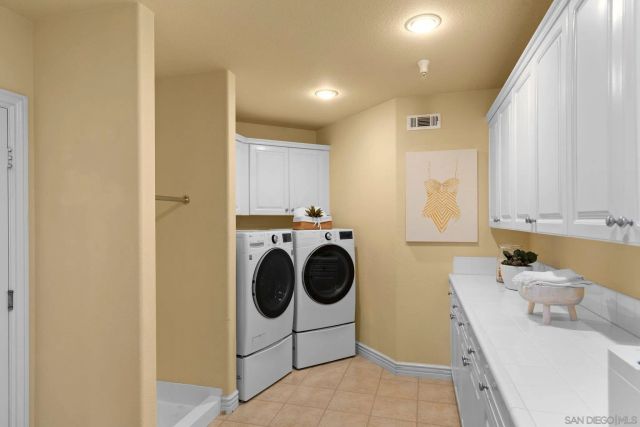 a view of a house with swimming pool and sitting area