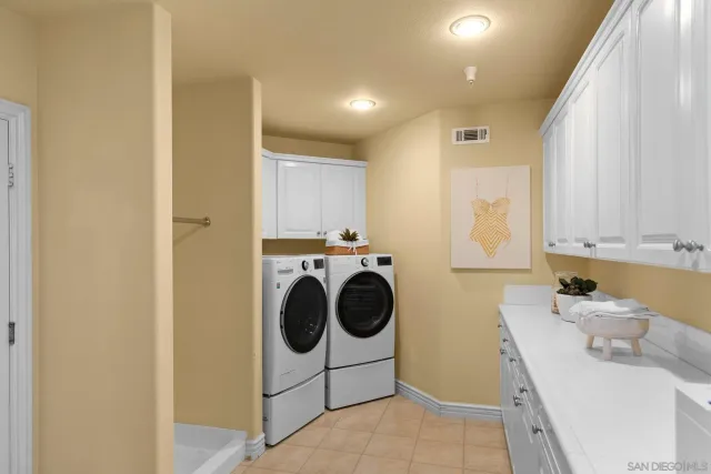 a view of a house with swimming pool and sitting area