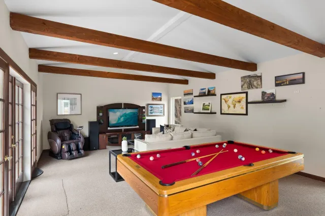 a front view of a house with a garden and plants