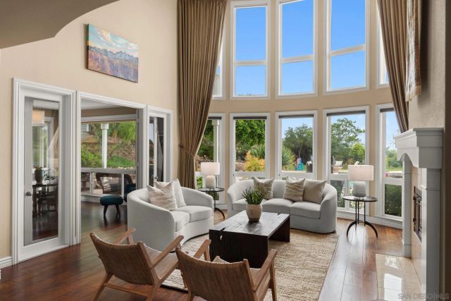 a dining room with furniture window and wooden floor