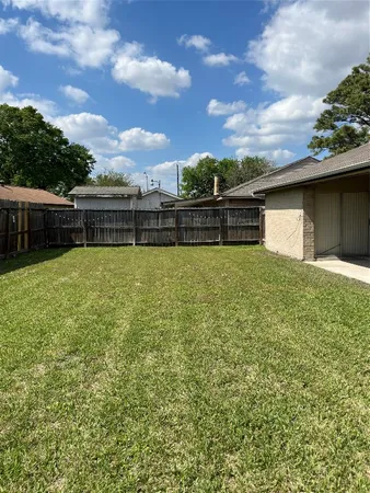 a view of a swimming pool with an outdoor seating and a garden