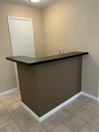 an empty room with wooden floor