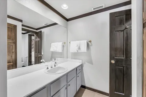 a white toilet sitting next to a bathroom sink and shower