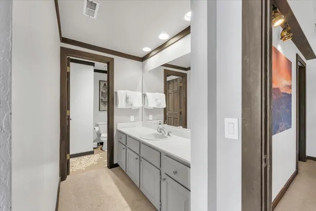 a bedroom with two beds and large window