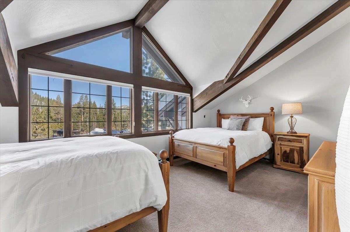 227 Olympic Vly Road, Unit 15 Olympic Valley, CA 96146 - Photo 19 of 28 a bedroom with two beds and large window