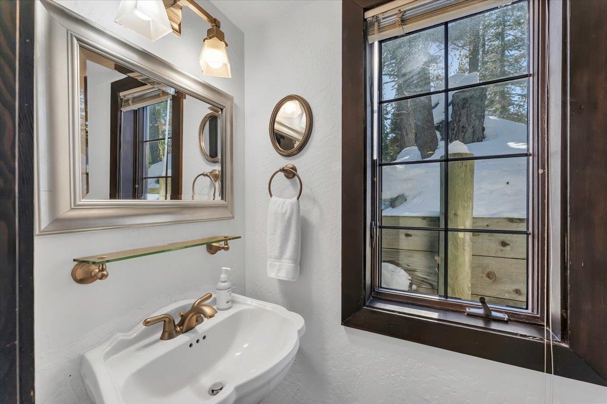 227 Olympic Vly Road, Unit 15 Olympic Valley, CA 96146 - Photo 27 of 28 a bathroom with a sink and a mirror