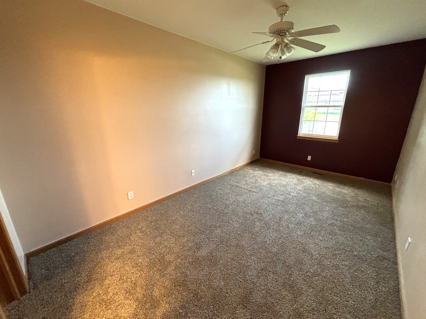 1923 Taller Road, Unit 1923 Morris, IL 60450 - Photo 6 of 12 an empty room with windows and fan