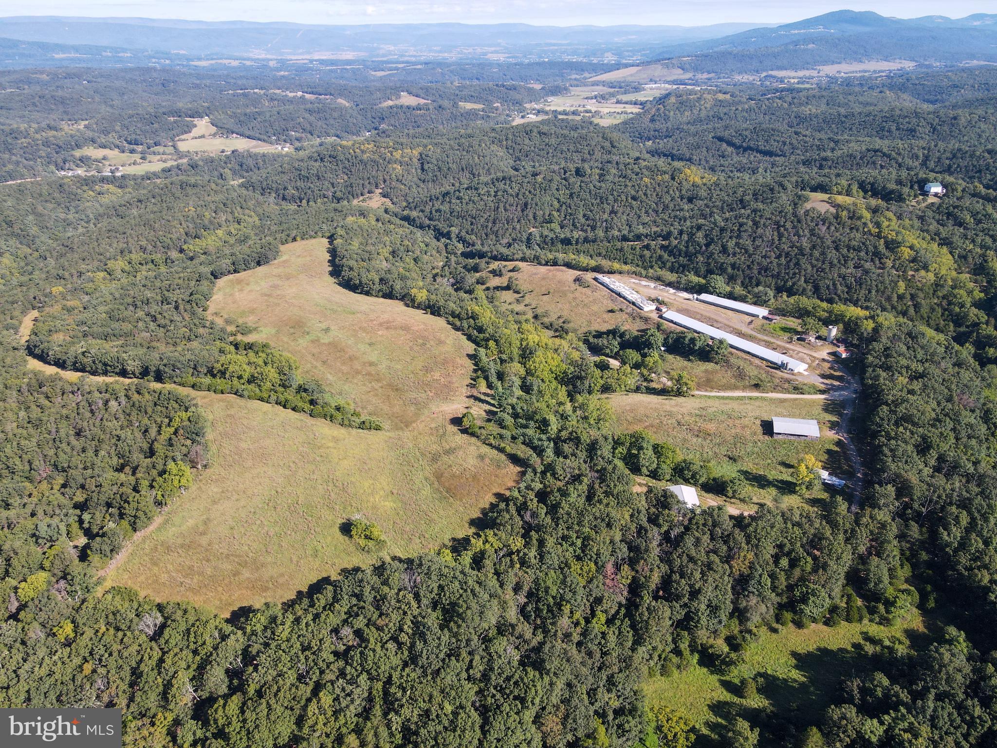 1030 Kites Road Petersburg, WV 26847 - Photo 6 of 51 Expansive green landscape with rolling hills.