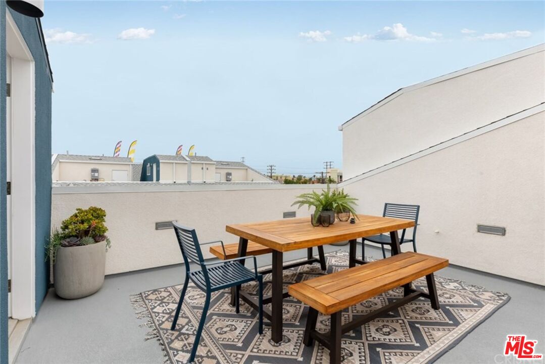 4821 1/2 Craner Avenue North Hollywood, CA 91601 - Photo 14 of 14 a dining room with furniture and potted plant