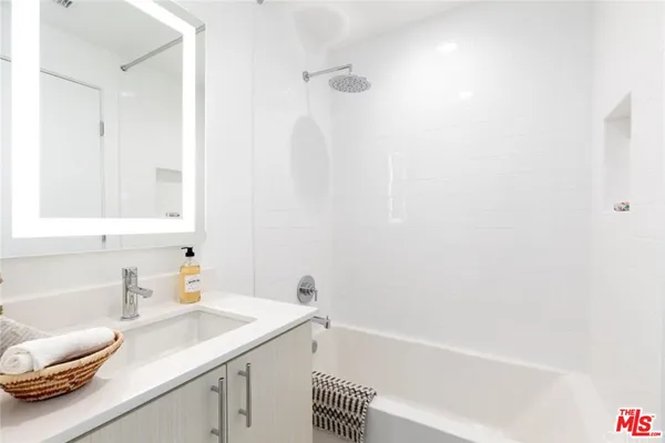 a bathroom with a sink and a bathtub