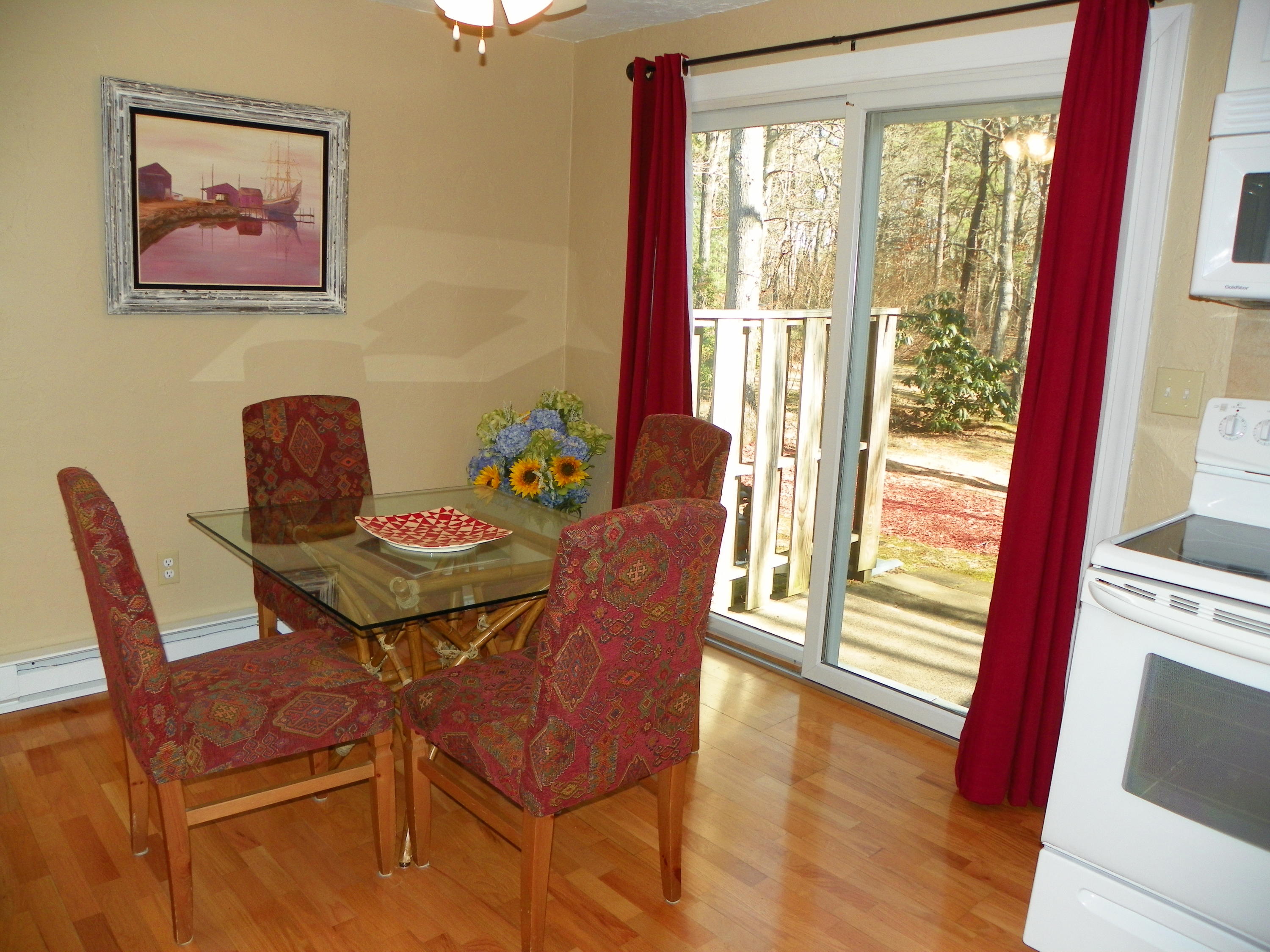 300 Falmouth Road, Unit 6E Mashpee, MA 02649 - Photo 11 of 32 a view of a dining room with furniture window and outside view