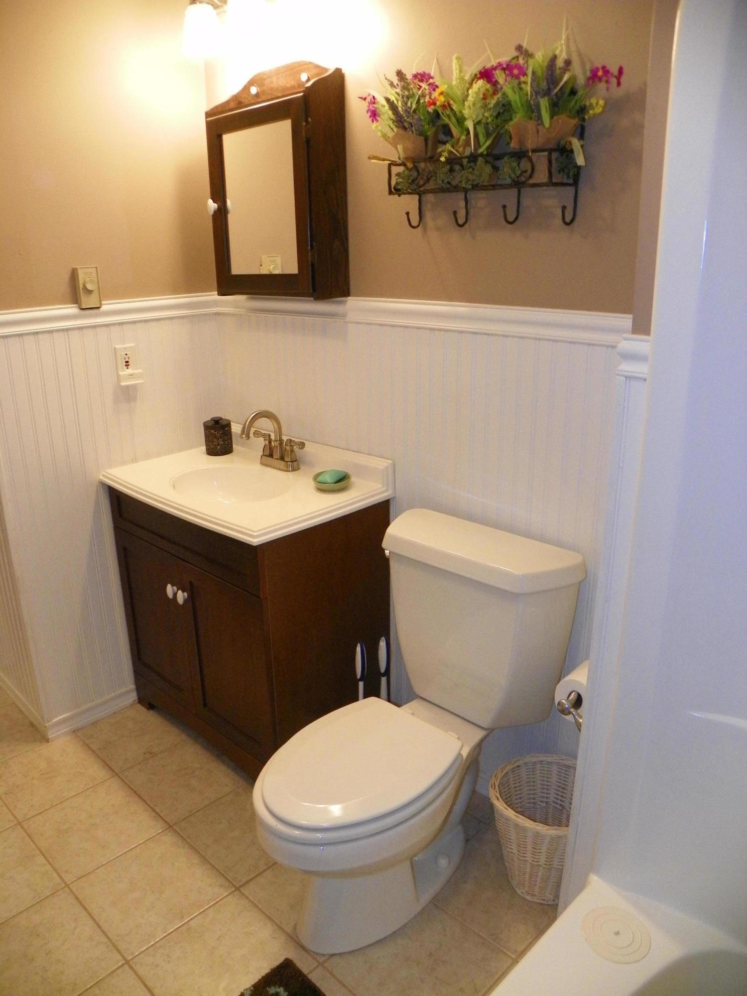 300 Falmouth Road, Unit 6E Mashpee, MA 02649 - Photo 17 of 32 a bathroom with a toilet a sink and mirror