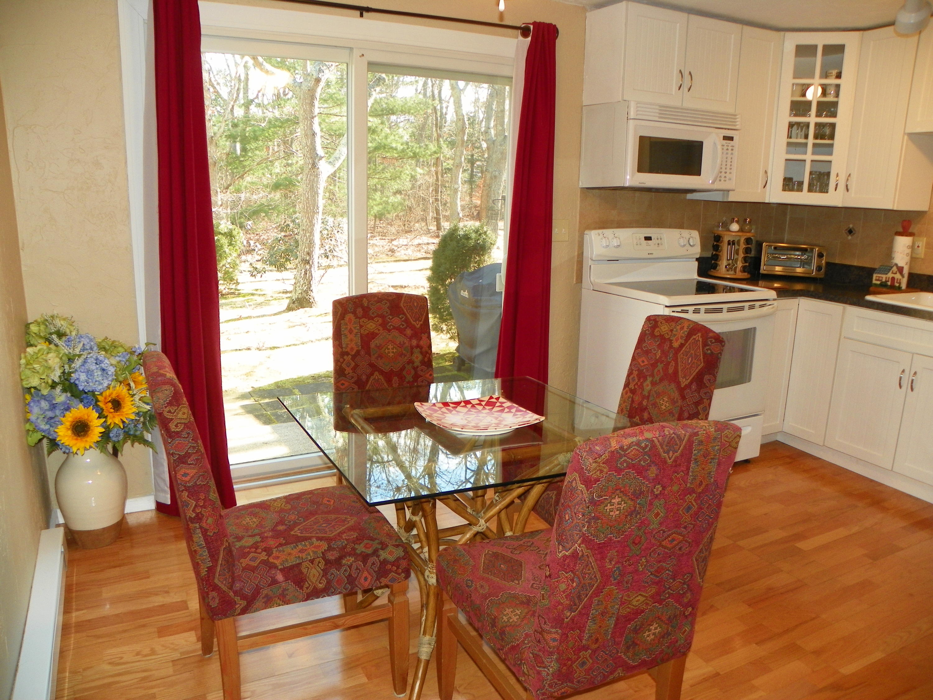300 Falmouth Road, Unit 6E Mashpee, MA 02649 - Photo 8 of 32 a living room with furniture and a floor to ceiling window
