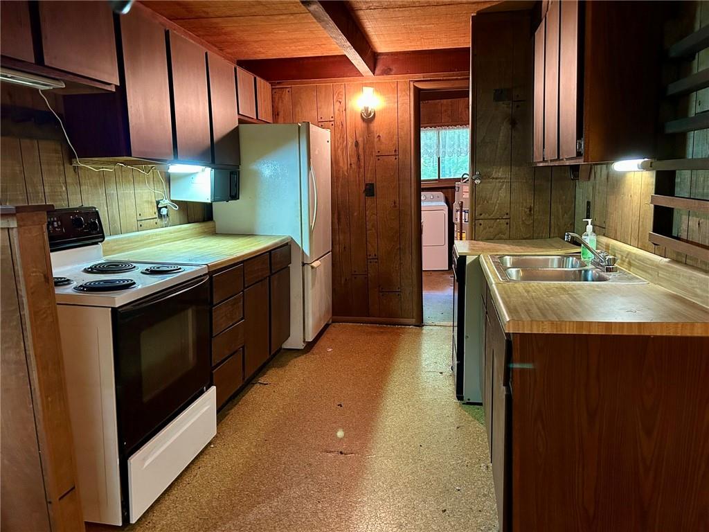 221 North Locust Road Acme, PA 15610 - Photo 11 of 26 a kitchen that has a sink stainless steel appliances a counter space and cabinets