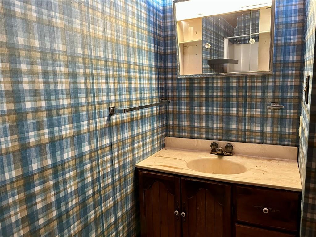 221 North Locust Road Acme, PA 15610 - Photo 16 of 26 a bathroom with a sink and a mirror
