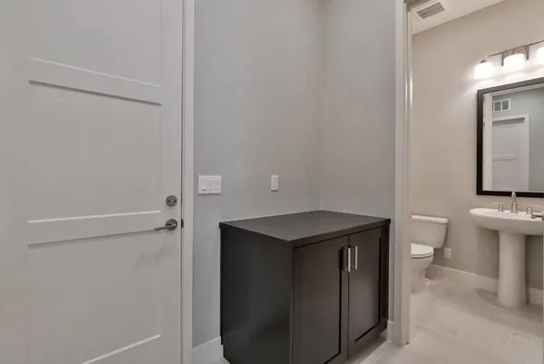 a utility room with cabinets washer and dryer