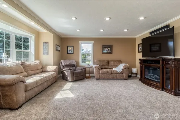 a living room with furniture and a flat screen tv