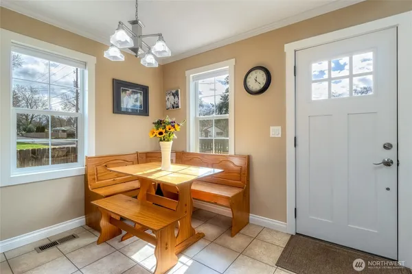 a dining room with furniture and window