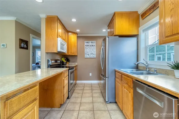 a kitchen with stainless steel appliances granite countertop a sink and a counter