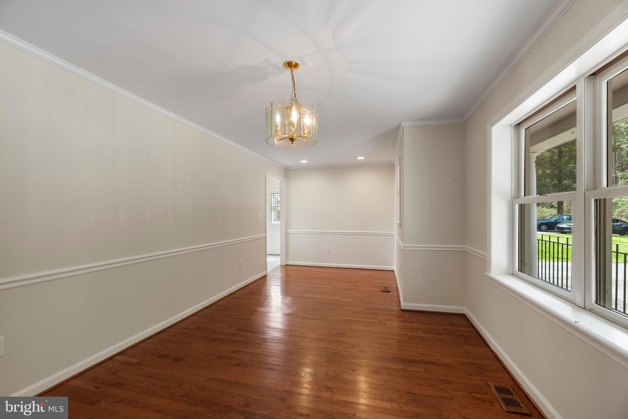 5929 Deale Beach Road Deale, MD 20751 - Photo 7 of 58 Unfurnished room featuring a chandelier, dark wood
