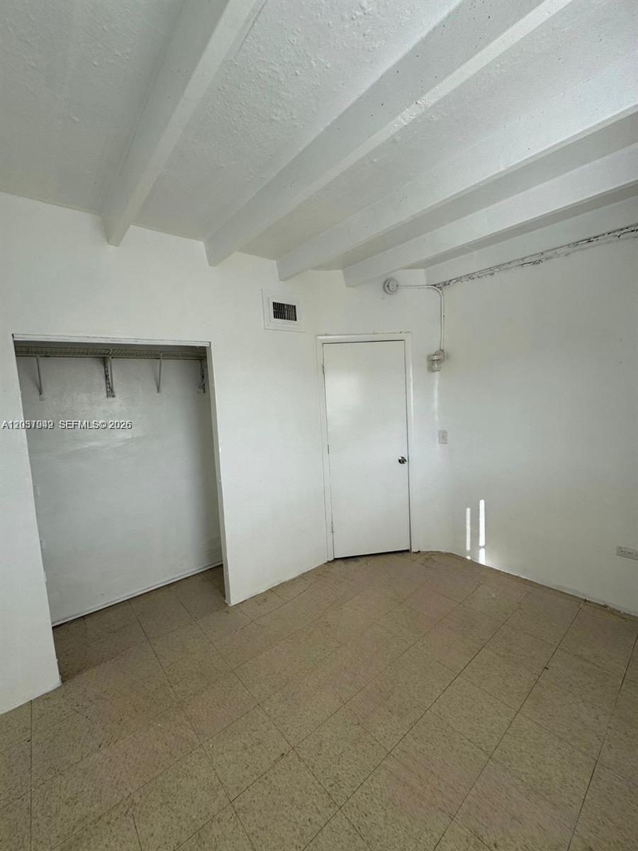 320 Southwest 11th Avenue, Unit 2 Homestead, FL 33030 - Photo 6 of 11 an empty room with an empty space