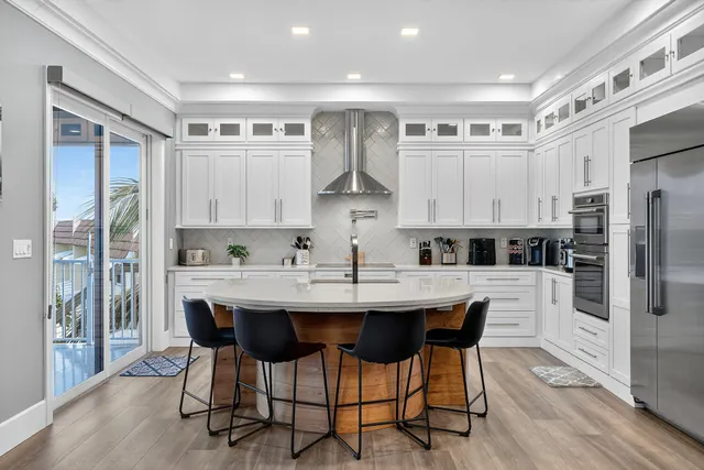 a spacious bedroom with a large bed and a large window