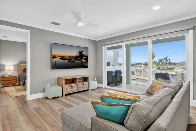 a view of a house with swimming pool and sitting area