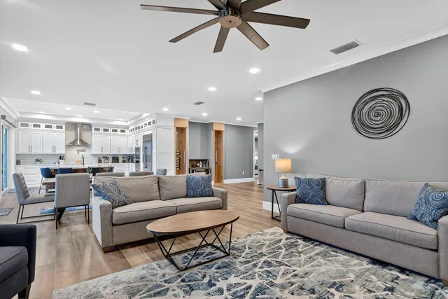a view of a kitchen with a sink and a refrigerator
