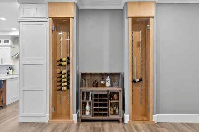 a large kitchen with kitchen island a table and chairs in it