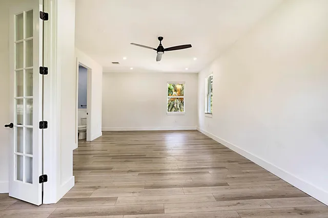 a view of an entryway with wooden floor