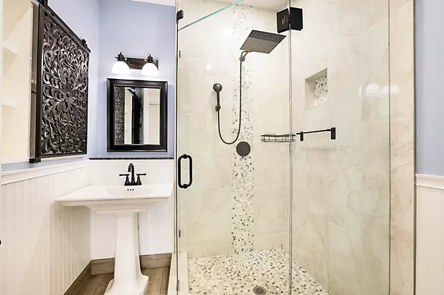 a bathroom with a sink and a mirror