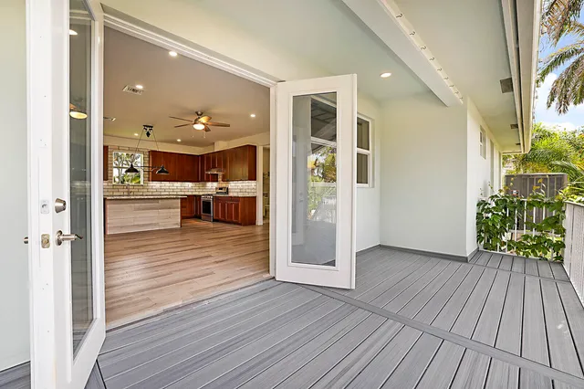 a view of a living room with wooden floor