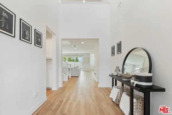 a kitchen with stainless steel appliances kitchen island granite countertop a refrigerator and a stove top oven