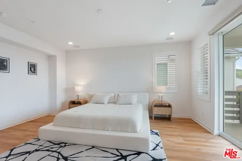 a bathroom with a double vanity sink and mirror