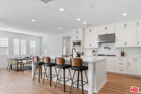 a large room with a couch and a large window