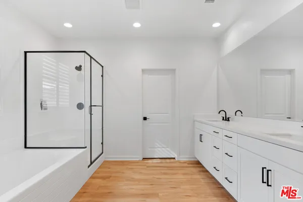 a bathroom with a bathtub and a shower