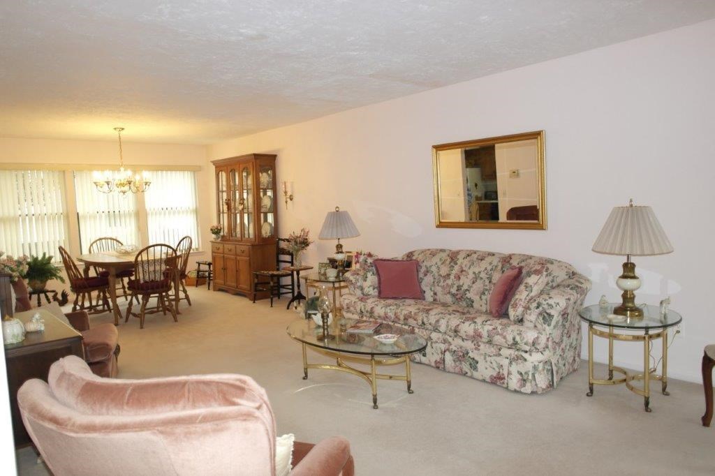 104 River Oaks Drive Rutherford, NJ 07070 - Photo 1 of 1 a living room with furniture and a large window