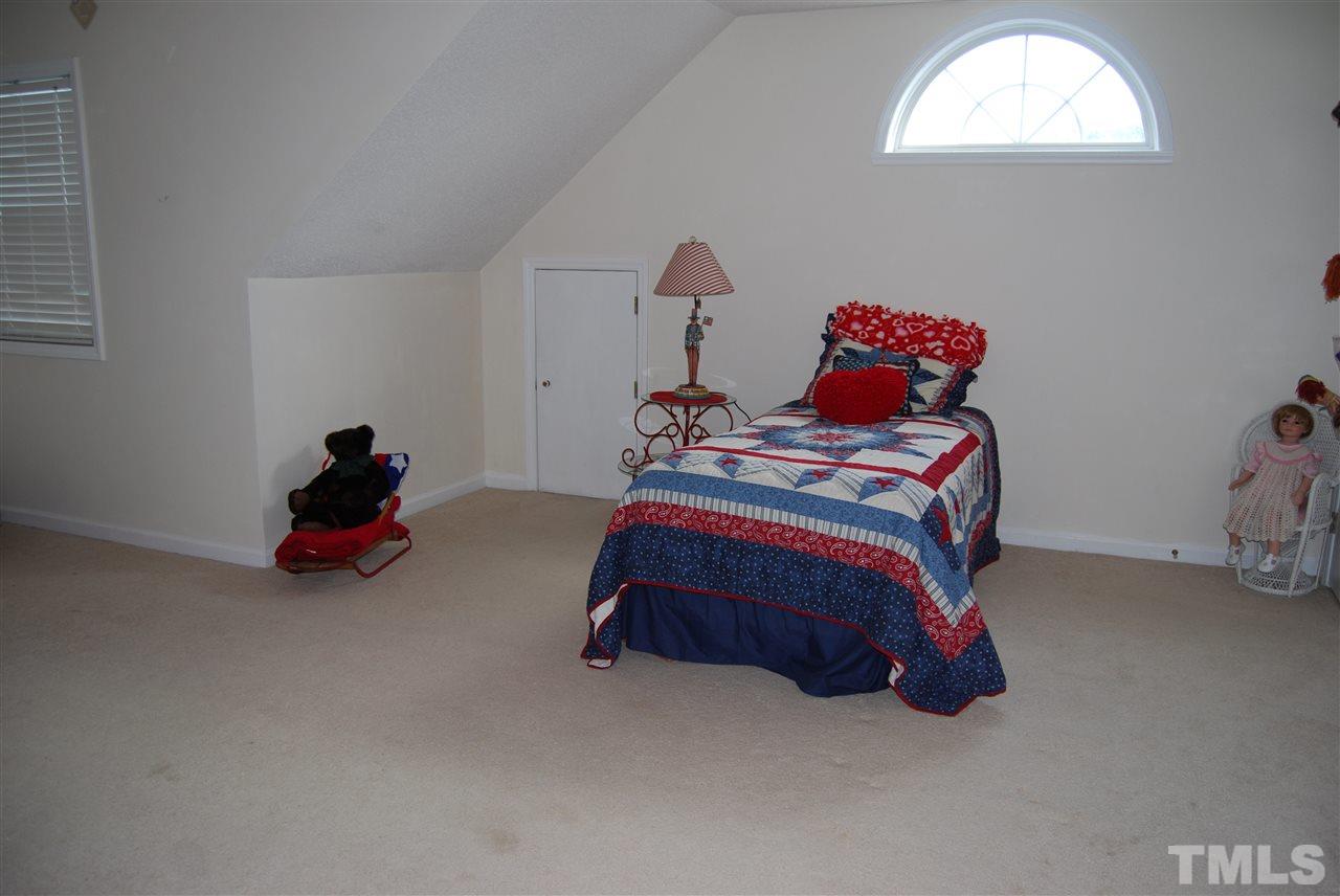 4301 Mantua Way Raleigh, NC 27604 - Photo 14 of 20 a bedroom with bed and a window