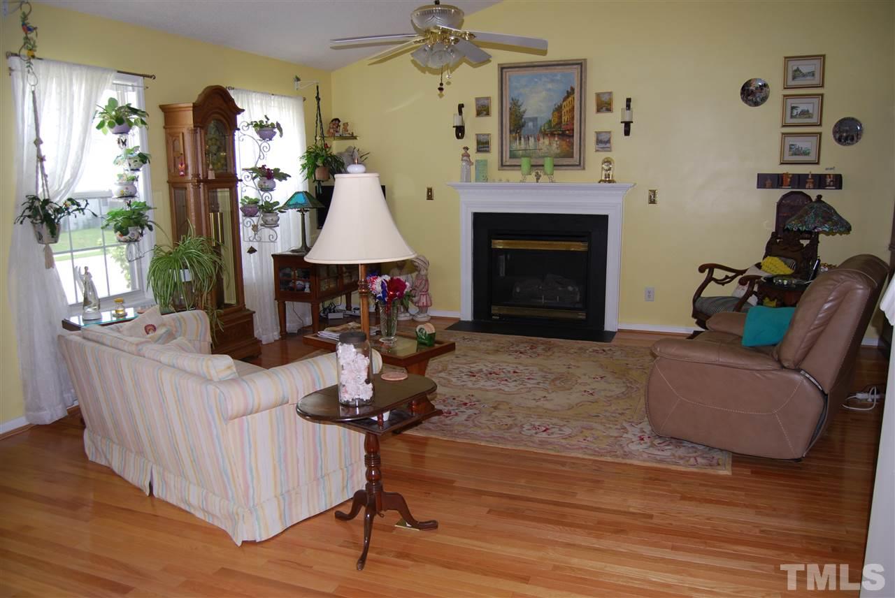 4301 Mantua Way Raleigh, NC 27604 - Photo 3 of 20 a living room with furniture and a fireplace