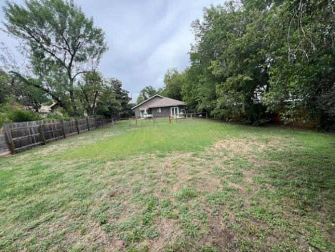 1809 Ford Street Austin, TX 78704 - Photo 5 of 5 a backyard of a house with lots of green space