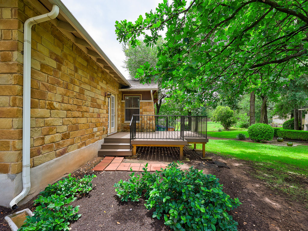 9707 Anderson Mill Road, Unit 22 Austin, TX 78750 - Photo 5 of 39 A private deck overlooks a verdant landscape, perfect for outdoor enjoyment.