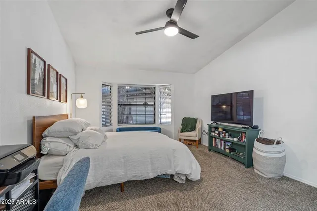 a bedroom with a bed furniture and a window