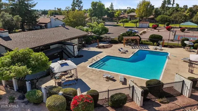 an aerial view of a house with garden space and street view