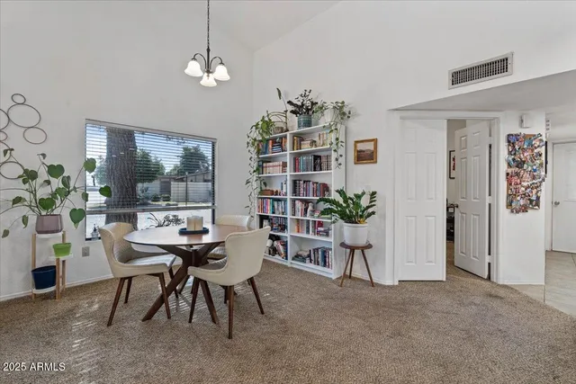 a workspace with furniture and a potted plant