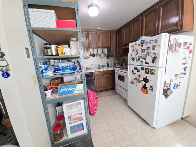 a bedroom with furniture and a flat screen tv