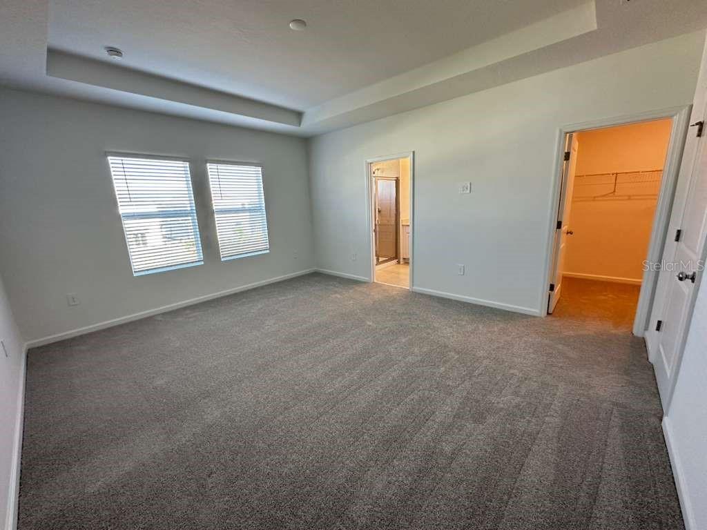 2729 Skyline Loop Kissimmee, FL 34758 - Photo 16 of 20 a view of an empty room with a window