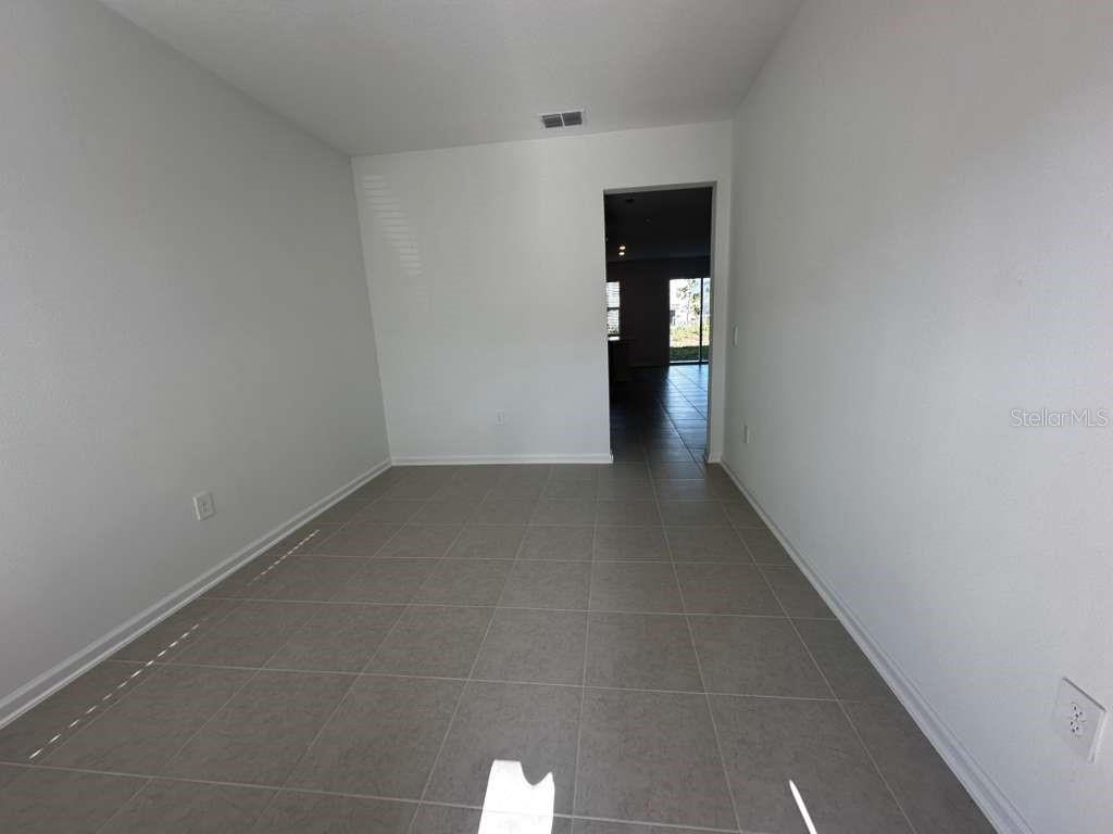 2729 Skyline Loop Kissimmee, FL 34758 - Photo 4 of 20 a view of an empty room and window